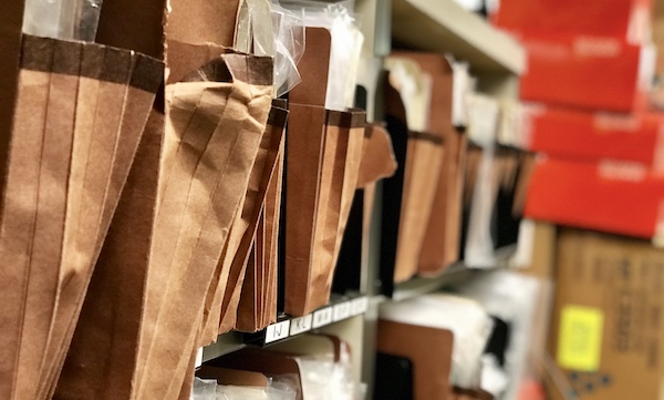 Image of files and folders in office space. Never throw away your private documents. Shred your personal papers when it's time to dispose of them.